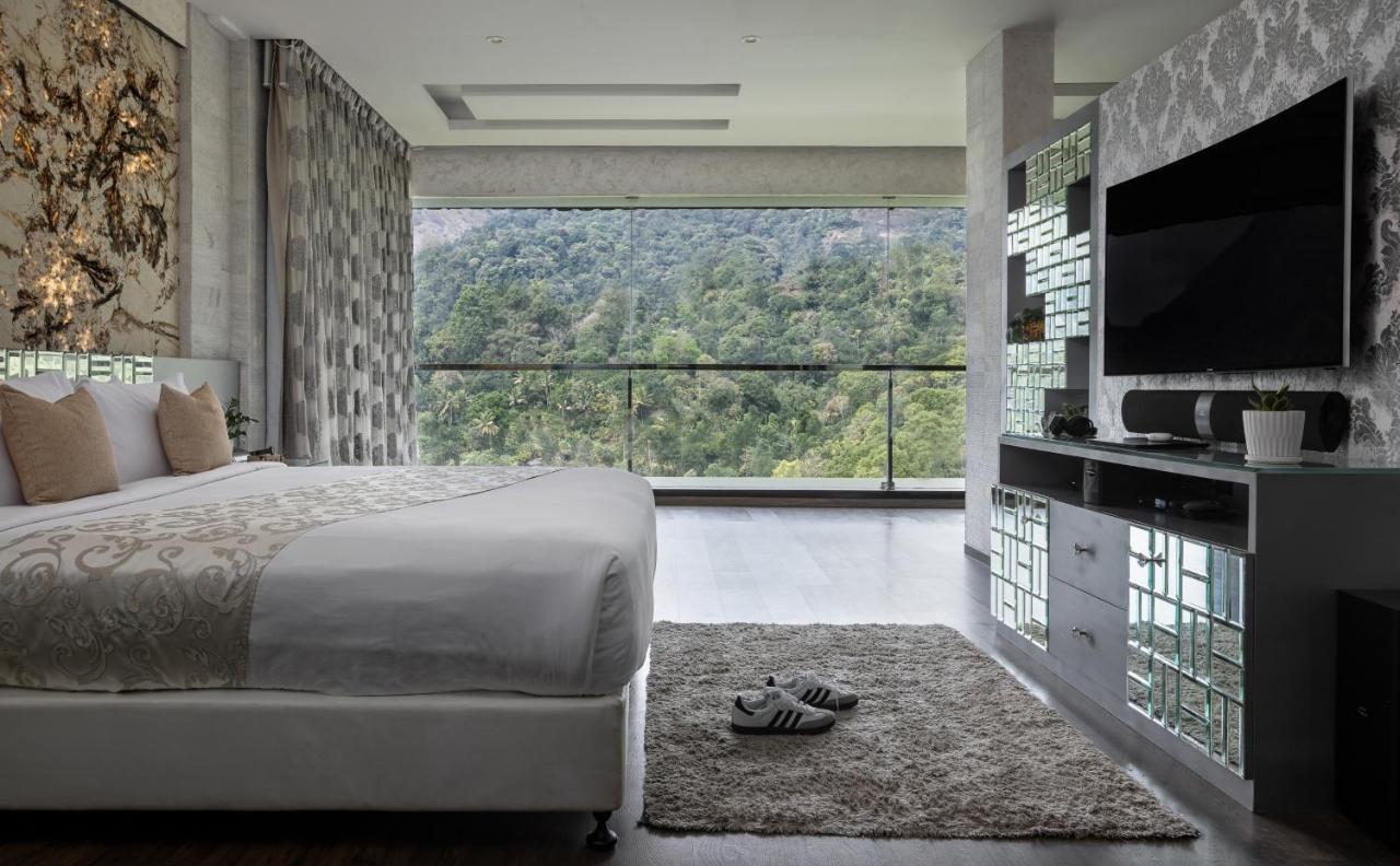 Hotel The Panoramic Getaway Munnar Exteriér fotografie A bedroom at the hotel